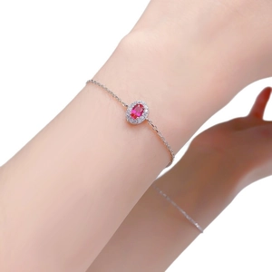 S925 silver bracelet featuring oval red halo gemstone on wrist with mirror reflection