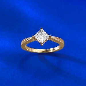 Macro detail of S925 hallmark on gold-plated ring with princess cut square zircon