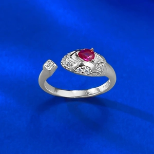 Detailed view of the S925 silver stamp and heart-shaped red gemstone on the snake ring