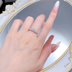 Close-up of S925 silver plated ring with sparkling pavé stones worn on hand