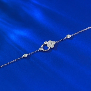 Adjustable S925 sterling silver four-leaf clover bracelet with pavé diamonds on blue silk