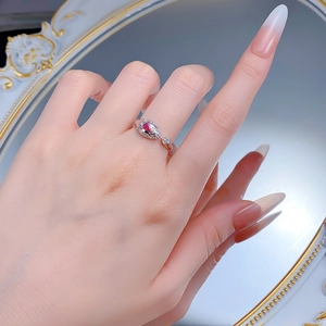 Detail of luxury snake-shaped S925 silver ring with water-drop red ruby gemstone