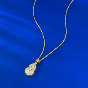Golden S925 silver gourd pendant necklace with teardrop moissanite on blue velvet