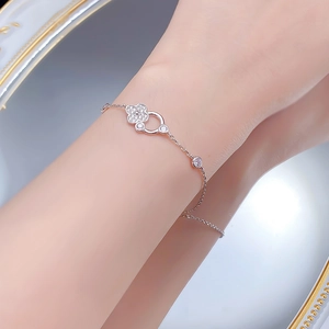 Detailed view of S925 silver lucky clover bracelet with shimmering cubic zirconia stones