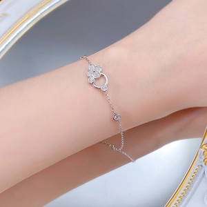 Detailed view of S925 silver four-leaf clover bracelet with sparkling zircon stones