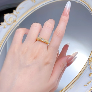 Close-up of S925 gilded ring with frosted finish and star-set sparkling zircon stones