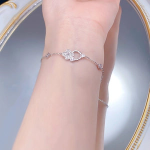 Close-up of S925 silver four-leaf clover bracelet with sparkling cubic zirconia stones
