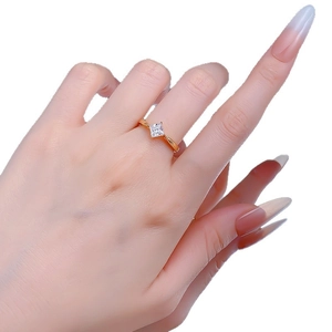 Minimalist S925 gold-plated square cubic zirconia ring on a hand with white background