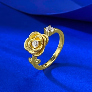 Elegant gold-plated S925 silver rose flower ring with sparkling zircon stone on blue background