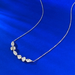 S925 sterling silver necklace with a curved pendant of multi-cut shimmering gemstones