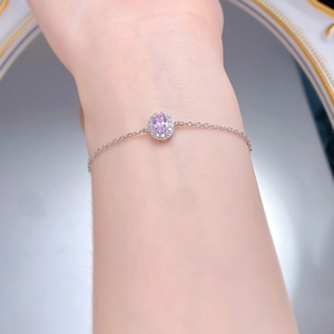 Close-up of S925 silver bracelet featuring oval pink zircon and sparkling halo stones