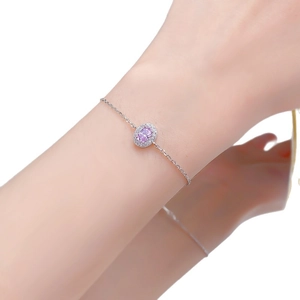 Elegant S925 silver bracelet featuring an oval pink gemstone in a classic halo setting