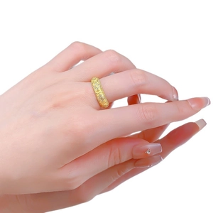 Gold-tone vintage clover lantern ring with intricate hollow engravings and small stones