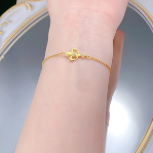 Detail of S925 silver iris flower bracelet with micro-pave gems on a female wrist
