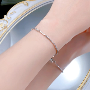 Detail of S925 sterling silver bamboo link bracelet with sparkling cubic zirconia accents