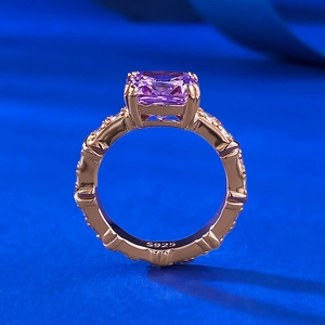 Macro view of S925 silver ring featuring purple cushion-cut stone and rose gold band