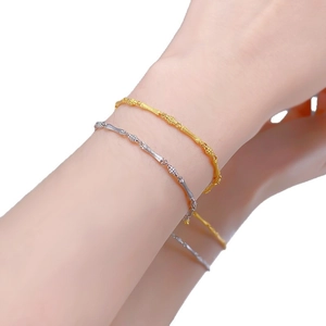 S925 sterling silver bamboo knot bracelets in gold and silver finish on model's wrist