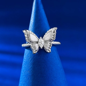 Macro shot of S925 silver butterfly ring with brushed wings and navette cubic zirconia