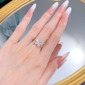 Detail of S925 sterling silver butterfly ring with pavé crystals and brushed finish