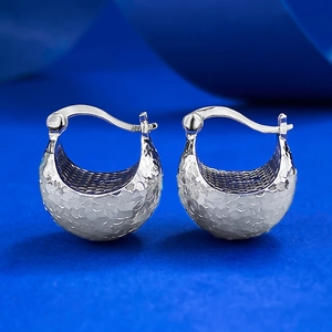 Detailed view of S925 sterling silver hoop earrings with a textured hammered finish surface