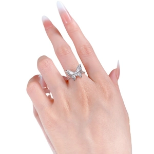 Elegant S925 silver butterfly ring with crystal pavé wings on a model hand