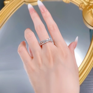 Detail of silver S925 triple-layer crisscross ring with micro-pave diamond setting