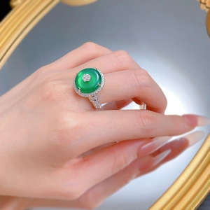 Macro view of S925 silver ring featuring green chalcedony and micro-pave diamond petals