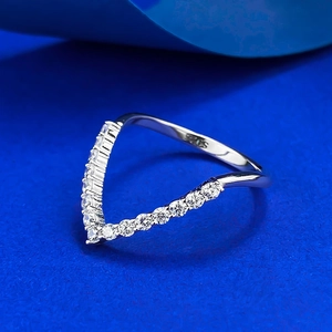 Elegant S925 sterling silver V-shape ring with pavé-set zircons on blue background