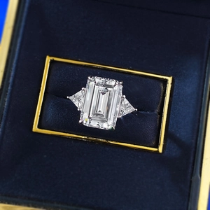 S925 sterling silver emerald cut crystal ring with trillion side stones in a blue box
