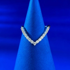 Macro shot of V-shaped sterling silver chevron ring with sparkling pavé cubic zirconia