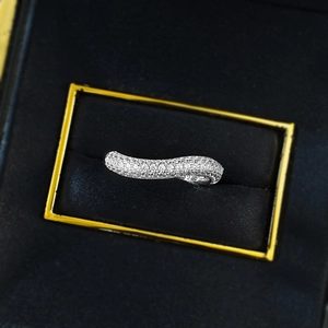 Macro shot of S925 sterling silver wavy ring with pave-set white zircons in a jewelry box