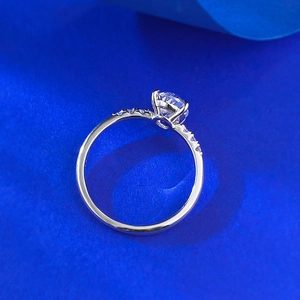 Detailed side view of 925 silver ring featuring a classic round gemstone in four-prong setting