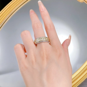 Detailed shot of luxury S925 sterling silver ring with ice cut yellow diamonds on finger