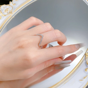 Detailed close-up of a stackable S925 sterling silver V-shaped ring with pavé diamonds