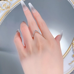 Detailed close-up of a minimalist S925 silver V-shaped ring with pave-set diamonds