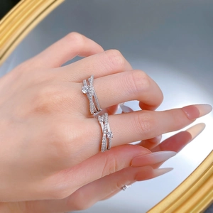 Macro detail of S925 silver triple-layered ring set with sparkling zircon pavé