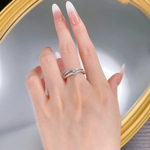 Macro detail of S925 silver triple-layered ring with sparkling pavé-set crystals