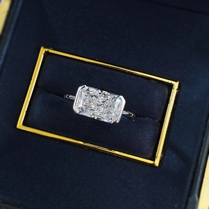 Top view of radiant cut rectangular gemstone ring set in S925 silver on velvet