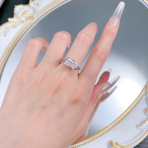 S925 sterling silver ring with a rectangular radiant cut crystal on a vintage mirror