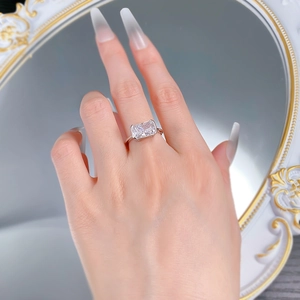 Detail view of a 925 silver ring featuring a large rectangular ice flower cut zircon on a hand