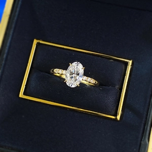 Elegant gold-plated S925 silver ring with large oval centerpiece in a blue jewelry box