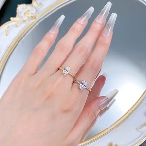 Detailed shot of oval cut gemstone rings with pave diamonds on gold and silver bands