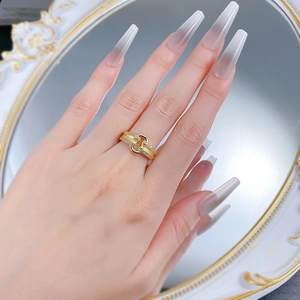 Elegant gold S925 silver geometric ring with shimmering zircons on female hand