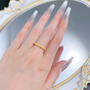 Satin brushed 925 sterling silver ring with three small zircons on a model's finger