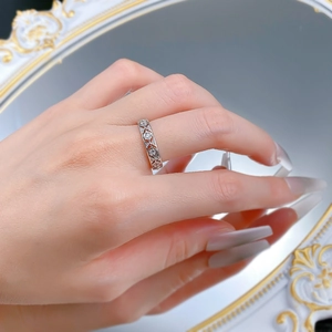 Detailed close-up of S925 silver lace pattern ring with small zircons on finger