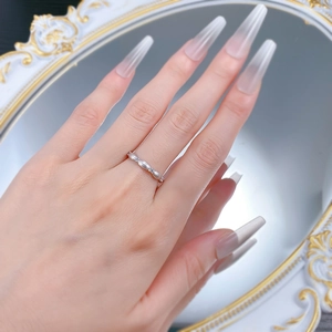 S925 sterling silver thin eternity ring with marquise and round stones on model hand