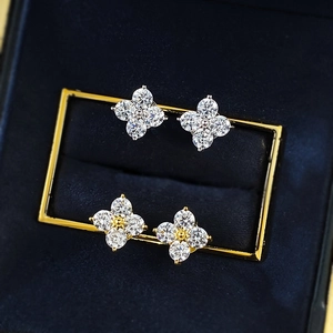 Elegant S925 silver and gold four-leaf clover stud earrings with sparkling round gemstones