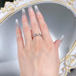 Macro view of S925 silver lace lattice ring with hollow carving and small round zircons
