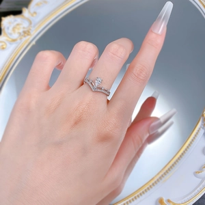 Elegant S925 silver double V-shaped crown ring with a pear-cut main stone and micro-pave