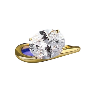 Golden S925 silver ring with 8x10mm oval clear gemstone on minimalist white background